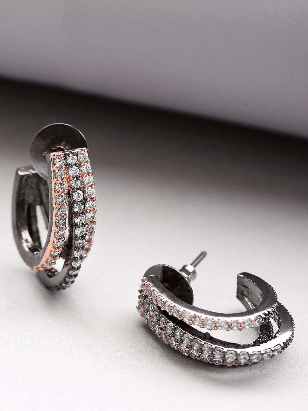 Gunmetal Plated American Diamond Studded Triple Layered Shape Drop Earrings