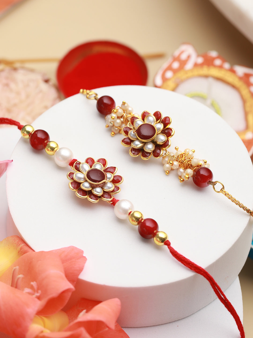 Red White Floral Pearl Rakhi Set with a Pack of Open Secret Chocolate Bars