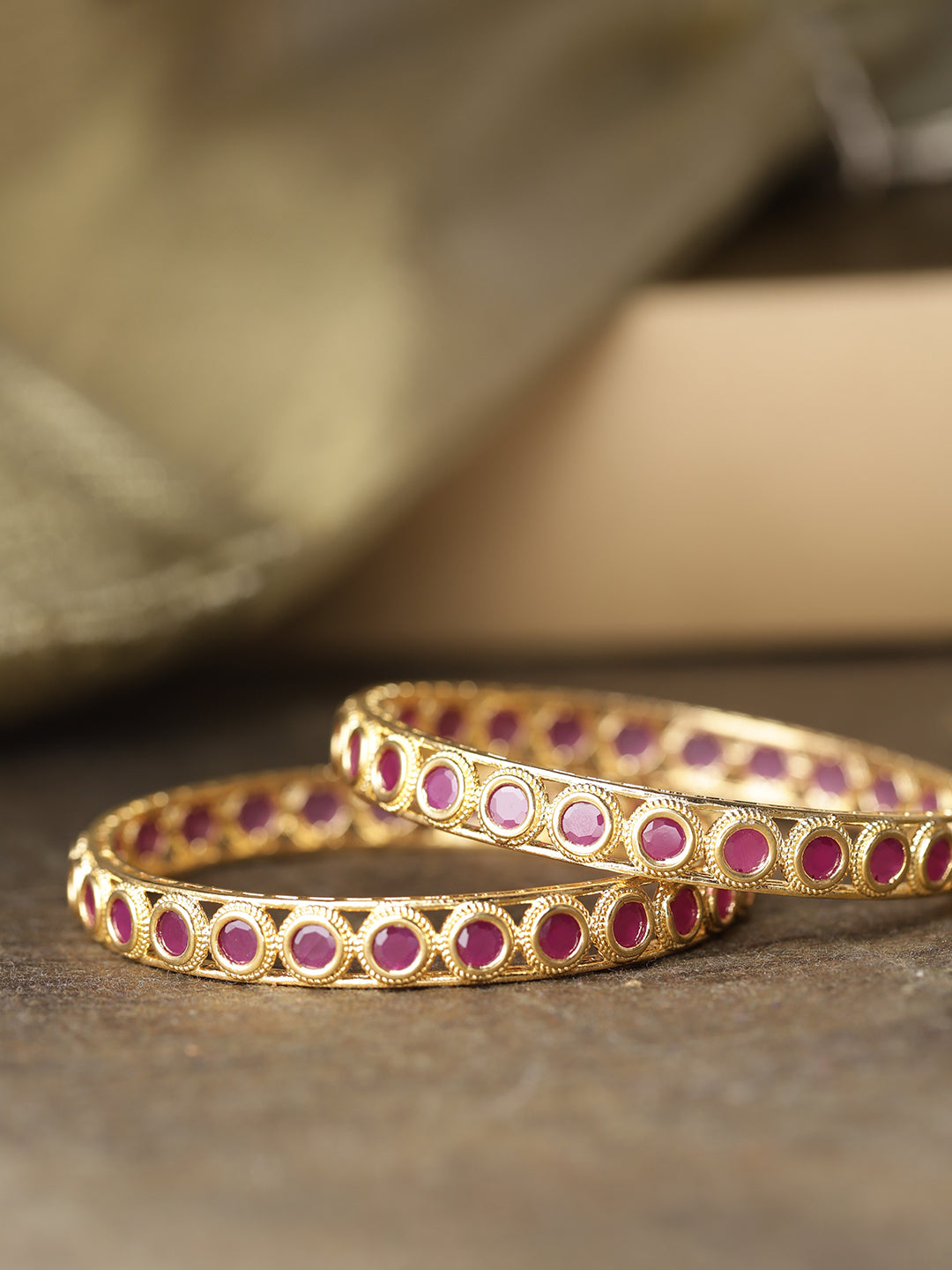 Set Of 2 Gold-Plated Circular Patterned Ruby Studded Bangles