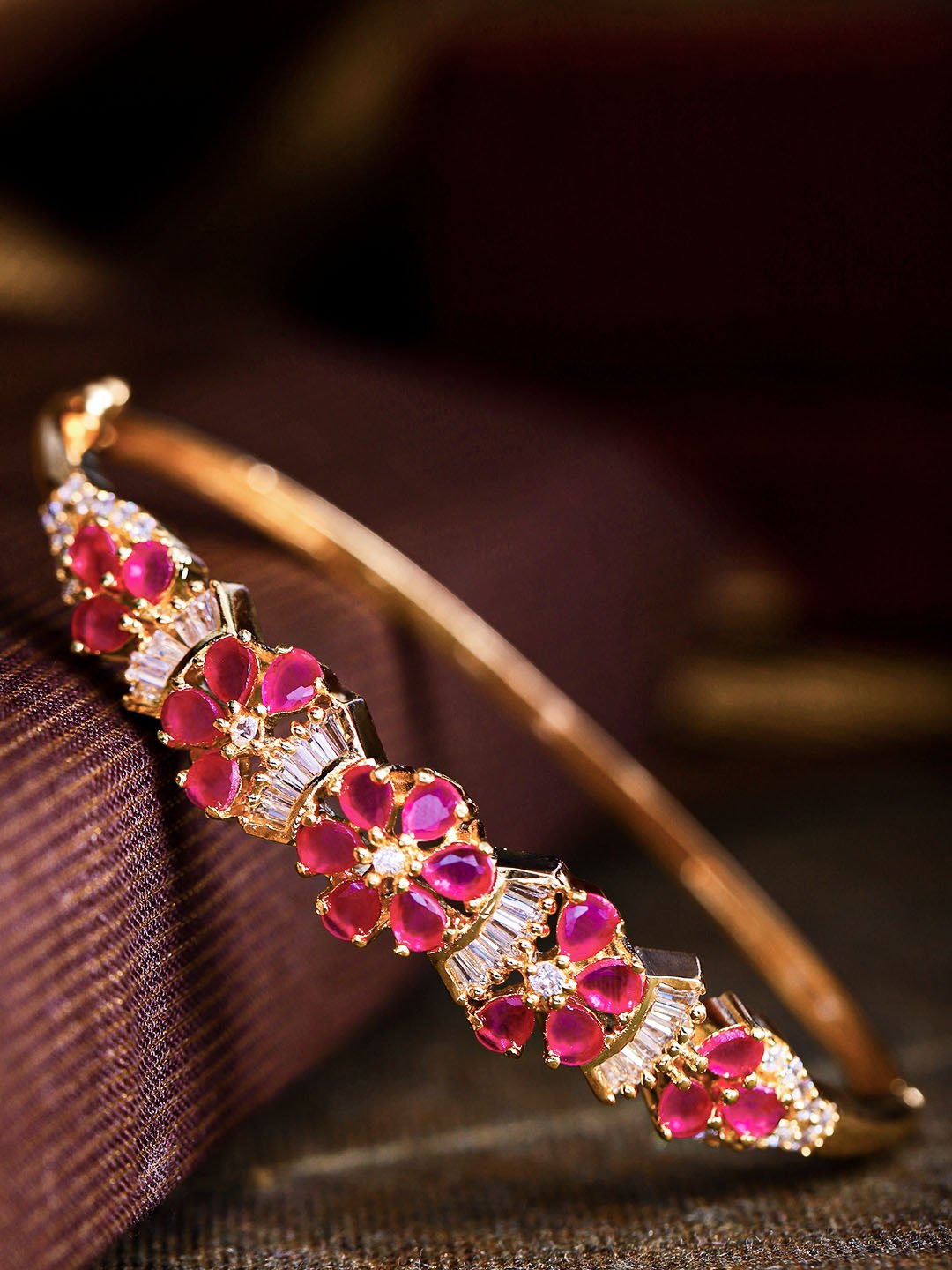 American Diamond and Ruby Stones Studded Floral Patterned Bracelet in Magenta Color