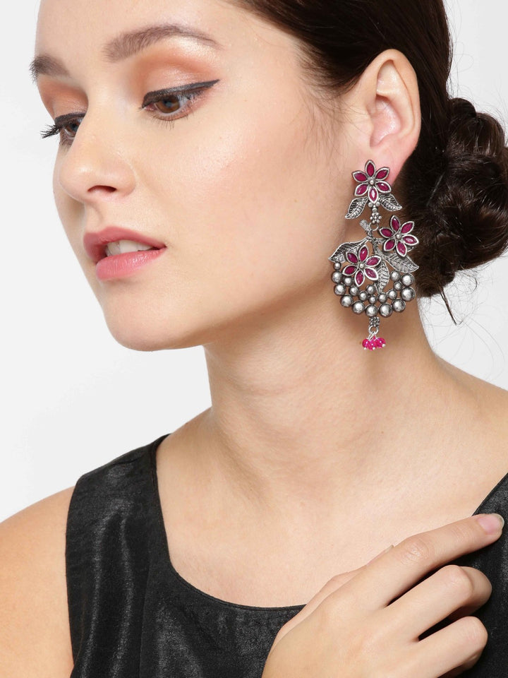Oxidised Silver-Plated Magenta Stones Studded Floral Patterned Drop Earrings