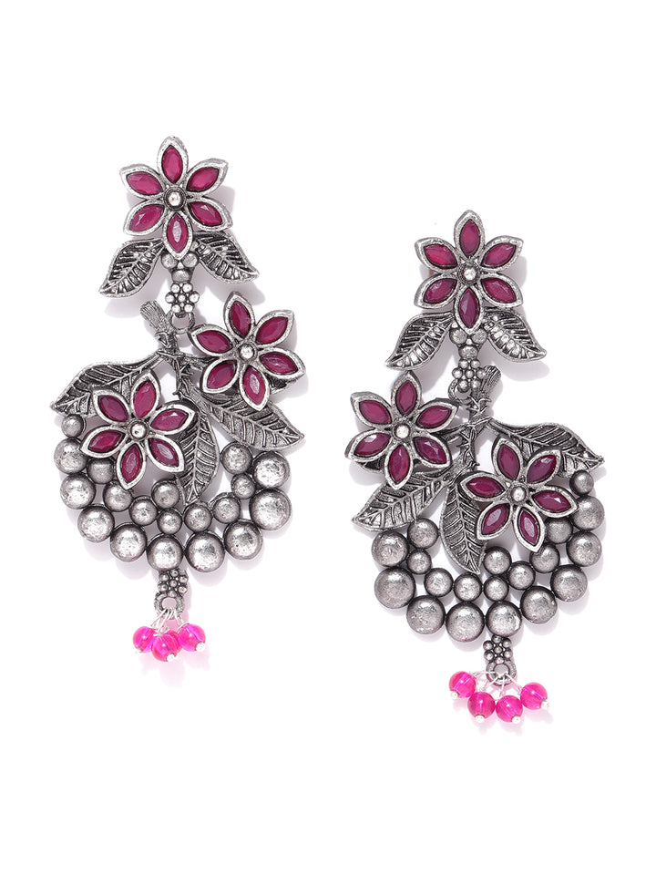 Oxidised Silver-Plated Magenta Stones Studded Floral Patterned Drop Earrings