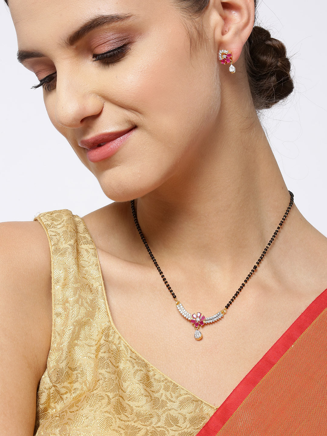Gold-Plated American Diamond and Ruby Studded Floral Patterned Mangalsutra Set with Earrings
